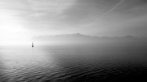 Lonely sailboat on a calm ocean.